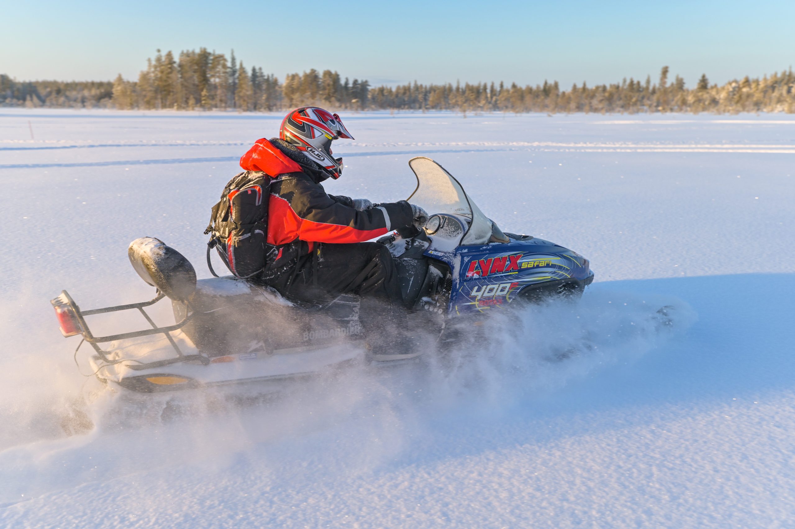 small group snowmobile driving in nature rovaniemi parpalandia
